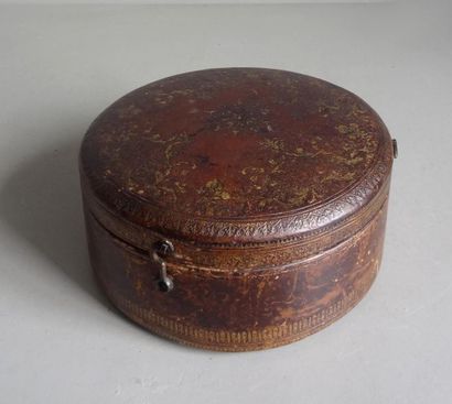 null Round box covered with leather and decorated with small irons in the manner...