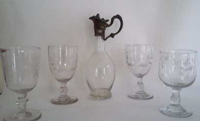 null Four stemmed glasses with engraved decoration and a small metal-rimmed pourer....