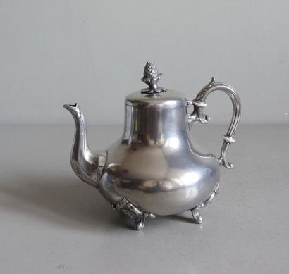null Small selfish teapot in the shape of a belly on four metal feet.
English work...
