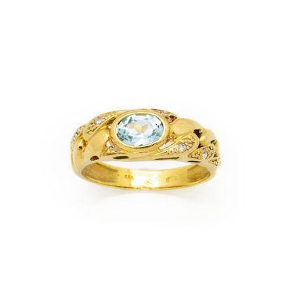 null Yellow gold ring decorated with a blue stone Gross 
weight: 3.7 g 
