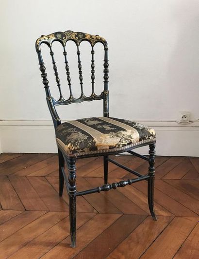 null Black lacquered wooden chair with golden rinceaux decoration. Napoleon III
period...