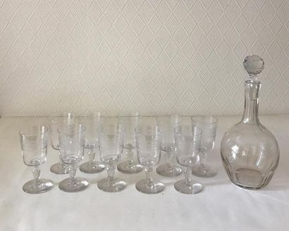 null Glass service part consisting of a carafe and ten small stemmed glasses. Late...