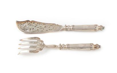 null Openwork metal fish cutlery with engraved decoration. The handle is made of...