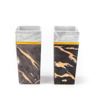 null Pair of square section vases in enamelled porcelain imitating marble with black
background...