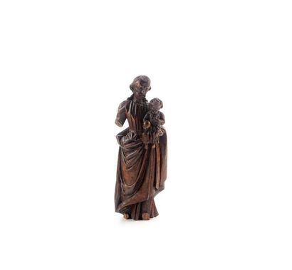 null Statuette en bois sculpté représentant Joseph et l'Enfant Jésus. XIXe
H.: 15...