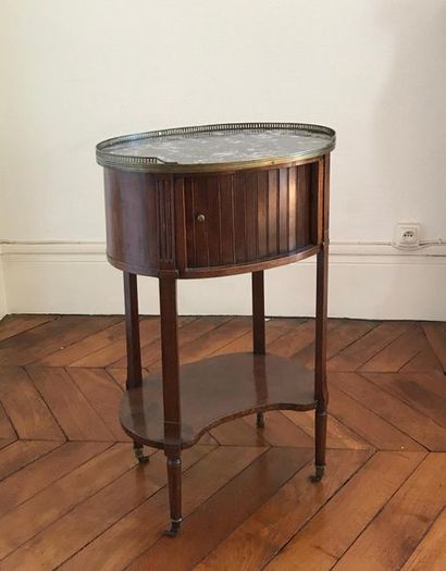 null Oval-shaped bedside table in mahogany and mahogany veneer. It opens by a curtain...