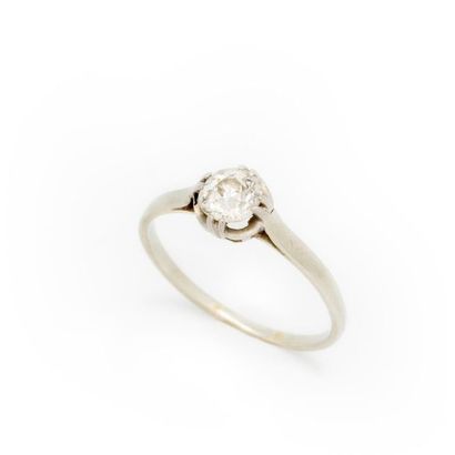 null Small white gold ring with a small solitaire diamond weighing approximately...