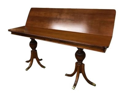 null Rectangular console table in mahogany and mahogany veneer. Flap top. It rests...