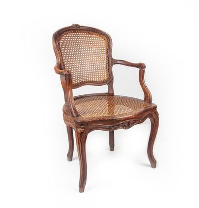 null Caned cabriolet armchair in natural wood with a violin back resting on four...