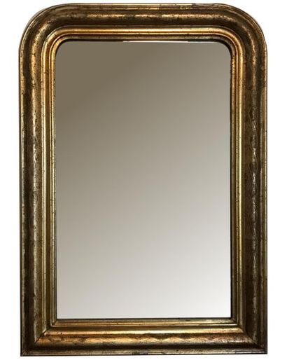 null Small mantel mirror in wood and gilded stucco molded and adorned with latticework....