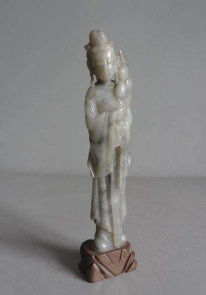 null CHINA
Statuette of a young woman holding a branch of flowers in hard stone....