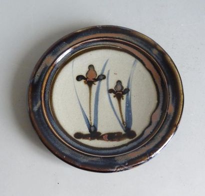null Glazed and glazed ceramic plate with central iris
decoration Scandinavian work...