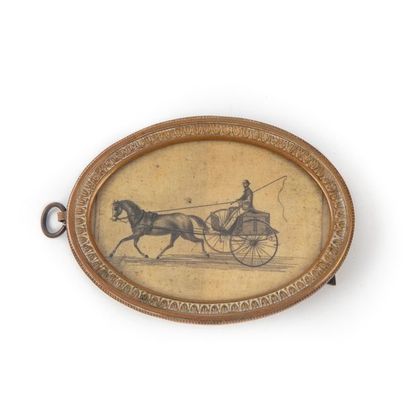 null Small engraving representing a harnessed car. in a brass frame of oval 
shape...
