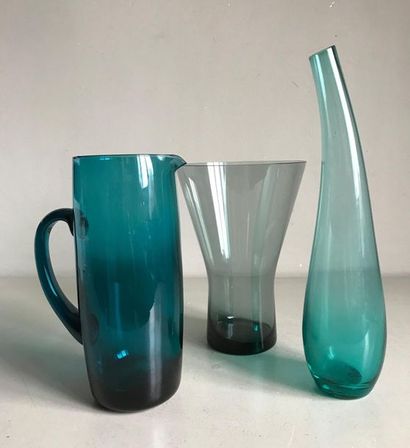 null Three Vintage vases and pitchers of various shapes in coloured glass.
H. 40...
