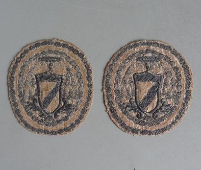 null Pair of oval medallions in silk embroidered with silver threads of an armoured...