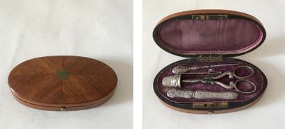 null Oval shaped sewing set made of veneer wood with a curling decoration and silver...