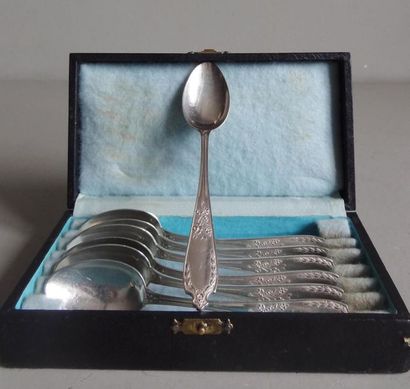 null Set of 7 small silver spoons chiselled with flowers, ribbons and leaves; end...