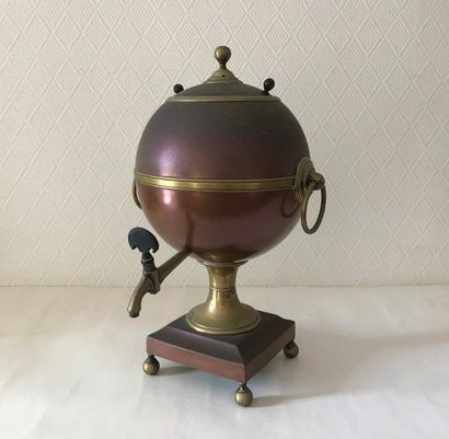 null Copper and brass tea fountain in a spherical shape. It rests on a quadrangular...