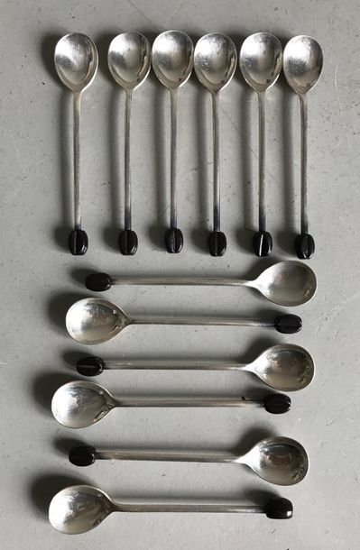 null Suite of 12 small teaspoons in silver plated metal finished with a bakelite...