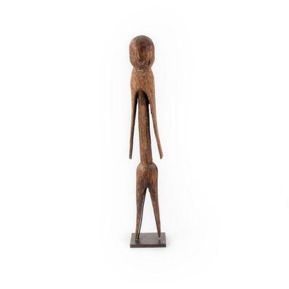 null MOBA, TOGO. 
Carved wooden altar statue showing a standing figure with arms...