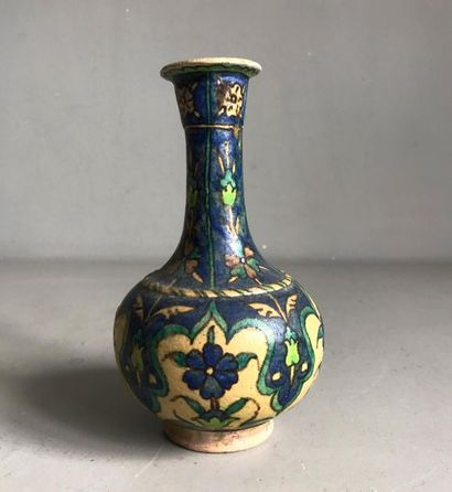 null IRAN
Small ceramic bottle vase decorated with polychrome enamels of flowers...