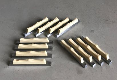 null Suite of twelve steel and ivory 
knife holders Circa 1930