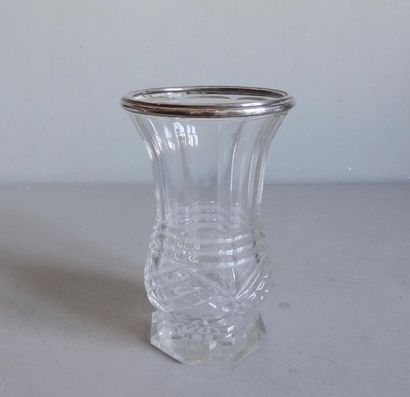 null Small baluster-shaped crystal vase cut on a polygonal base. The neck is bordered...