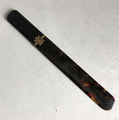 null Bakelite letter opener in brown tortoiseshell style decorated with a ciphered...