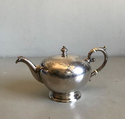 null Silver ball shaped teapot with engraved decoration of a frieze of palmettes...