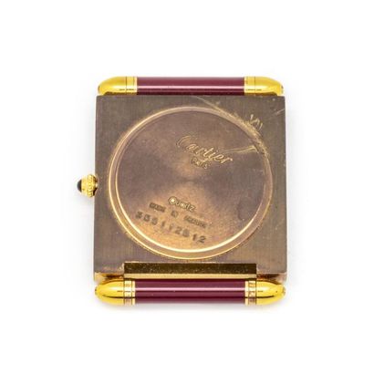 null CARTIER
Rectangular travel clock in gold-plated metal and burgundy lacquer,...