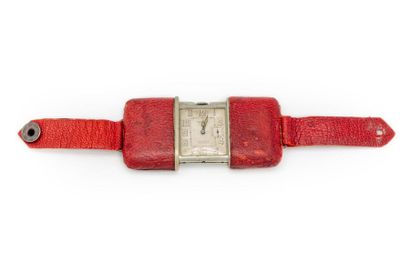 null MOVADO ERMETO
Metal chronometer watch covered in red leather. Silver dial signed...
