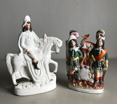 null STAFFORSHIRE
Two polychrome "creamware" statuettes, one representing a horseman...