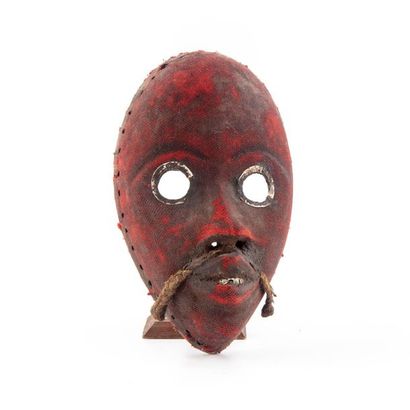 null DAN, IVORY COAST.
Wood covered with red cloth, metal, vegetable fibres. 
Fire...
