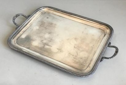 null Rectangular serving tray in silver plated metal. The rim and handles are chiselled...
