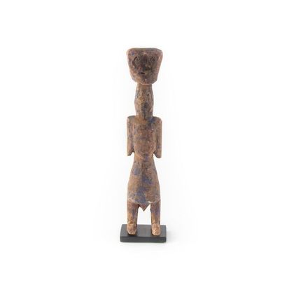 null ADAN, TOGO.
Wood, polychrome pigments.
Statue of protective spirit known as...