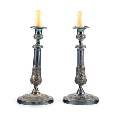 null Pair of silver plated metal candleholders decorated with foliage. Middle XIXth
H.:...