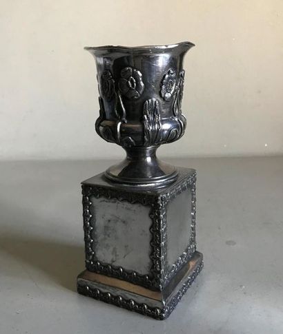 null Small vase shaped planter on a pedestal resting on a square section base made...
