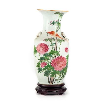 null CHINA Porcelain
vase of baluster shape with polychrome decoration of flowers...