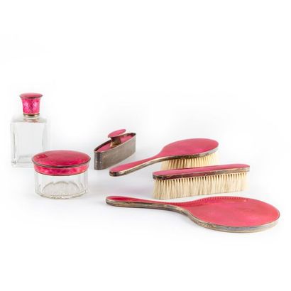 null Pink enamelled vermeil silver mounted toiletry set on a guilloche pattern background...