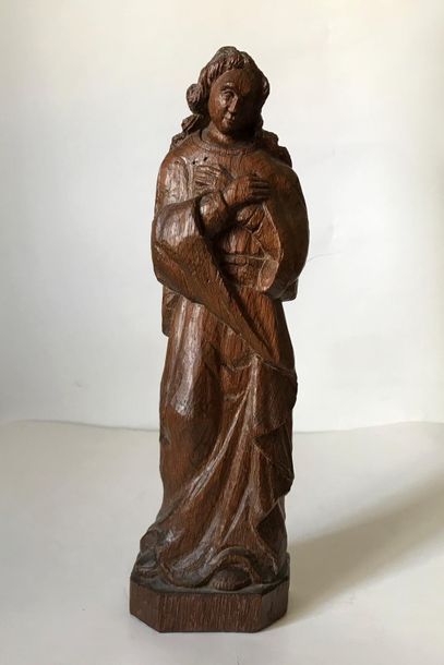 null Carved wooden statuette representing a Saint in the Gothic style
H. 29 cm