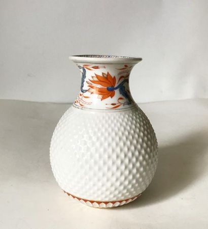 null Small egg-shaped vase in white porcelain with a diamond-shaped belly and a frieze...