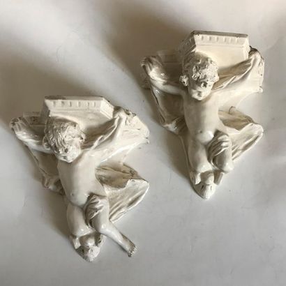 null Pair of earthenware wall light brackets with Putto decoration in relief
H. 21...