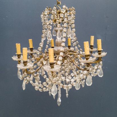 null Chandelier with nine gilt bronze light arms and garlands of pearls in the style...