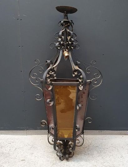 null Lantern in wrought iron, polygonal shape with red and orange
glasses H.: 80...