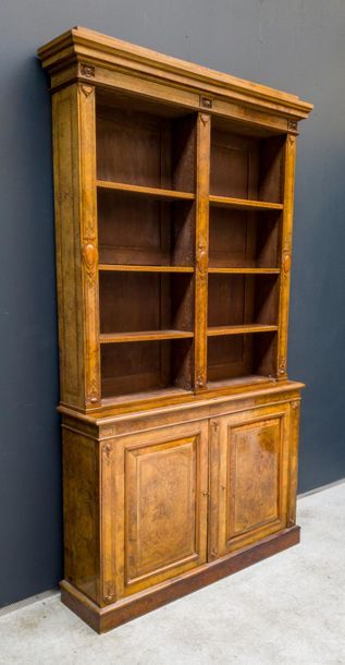 null Bookcase in light wood veneer with inlaid decoration of nets and checkerboards....