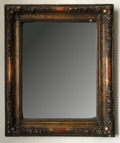 Small mirror in wood and gilded stucco molded...