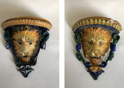 null Pair of brackets (slight differences) of polychrome earthenware appliqués with...