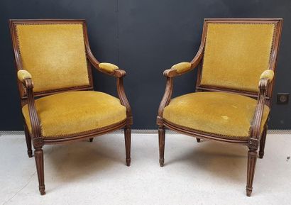 Pair of armchairs in moulded natural wood....
