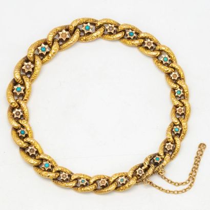 null Bracelet in yellow gold with articulated links adorned with turquoise 
Weight:...