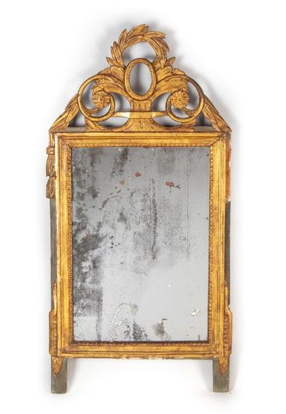 Mirror in gilded wood, moulded and carved...